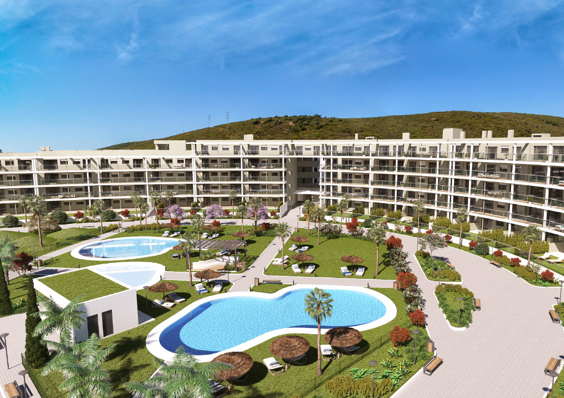 Amphora Beach Fase III Manilva - aerial view of luxury residential complex with two freeform swimming pools, landscaped gardens, palm trees and multi-storey facades
