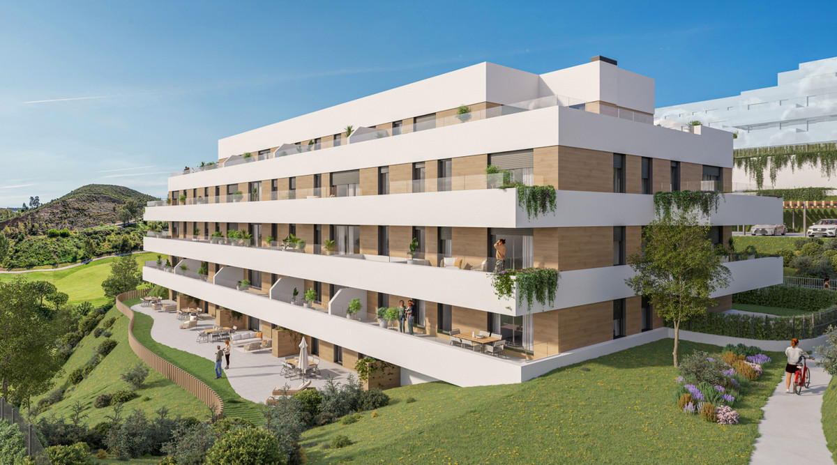 Culmia Cala Swing Mijas Fase II – Calanova Golf - modern white residential building with wood-clad facade, wraparound terraces and green hillside views
