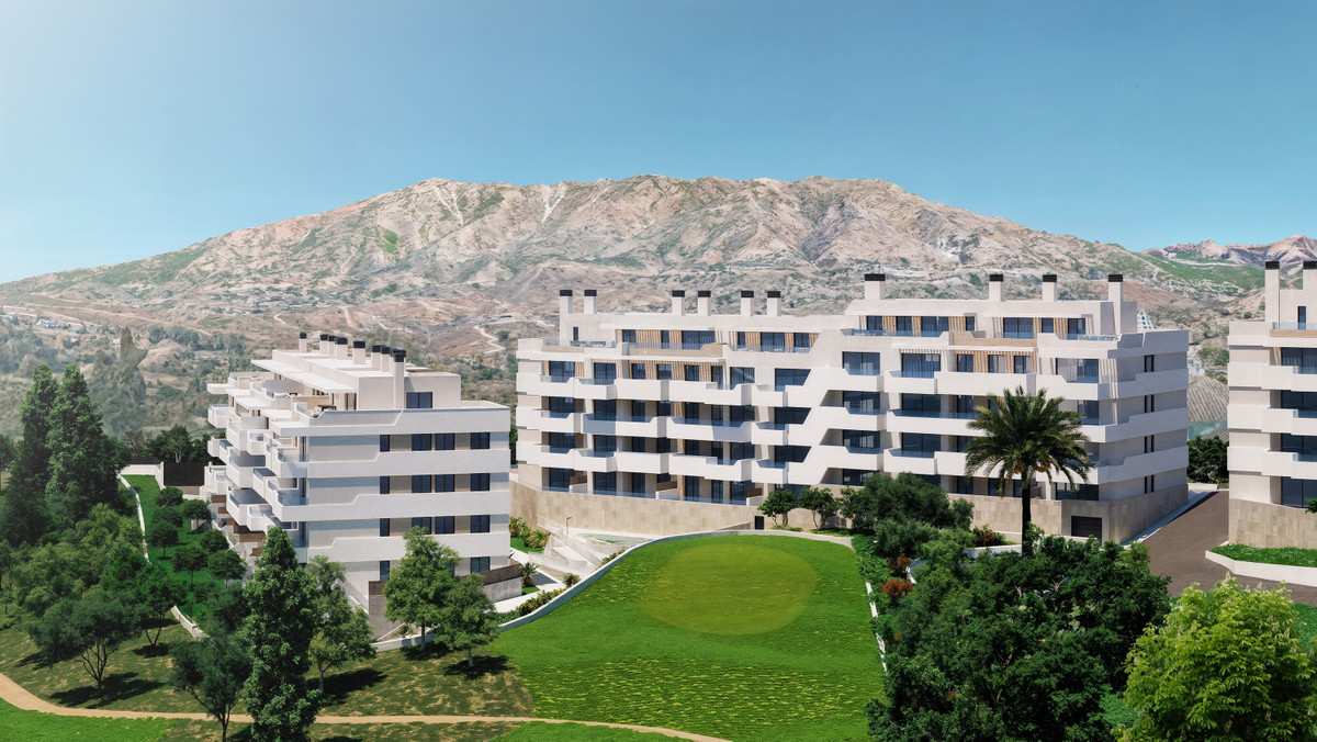 Helvet Green – Mijas - modern white apartment buildings with mountain backdrop and green golf course