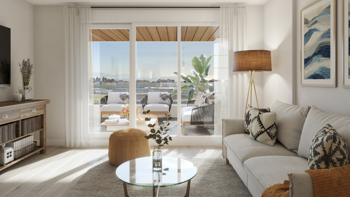 RESIDENCIAL LIVING GARDENS – Torremolinos - bright living room with large sliding doors opening to a furnished terrace with city views