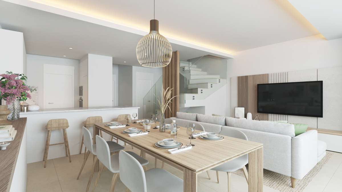 Alexandra's Dream – El Chaparral - open-plan dining and living area with wooden table, pendant light and staircase