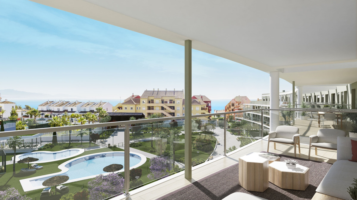 Amphora Beach Fase IV – Manilva - spacious terrace with pool, garden, and sea views beyond residential rooftops