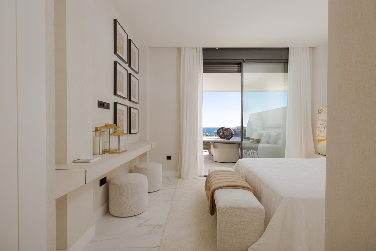Balcon del Mediterraneo – New Golden Mile - luxury bedroom with marble floors, built-in shelving, and sea-view terrace