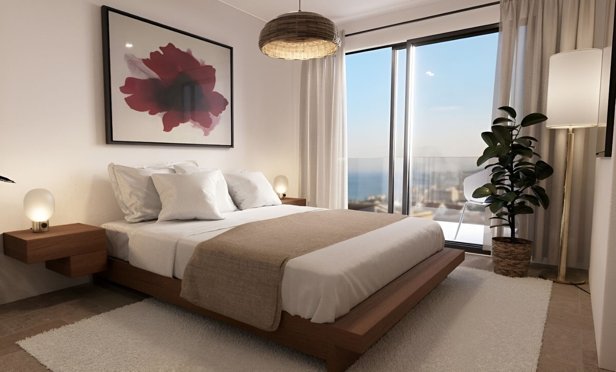 Casa 1 – Bougaivillea Rosa – Torreblanca - luxury bedroom with sea views, wooden platform bed and floor-to-ceiling windows