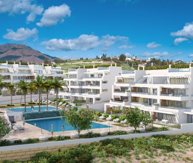 Costafiore Gardens – Fase 1 – Estepona - luxury white residential complex with outdoor swimming pool, palm trees and mountain views