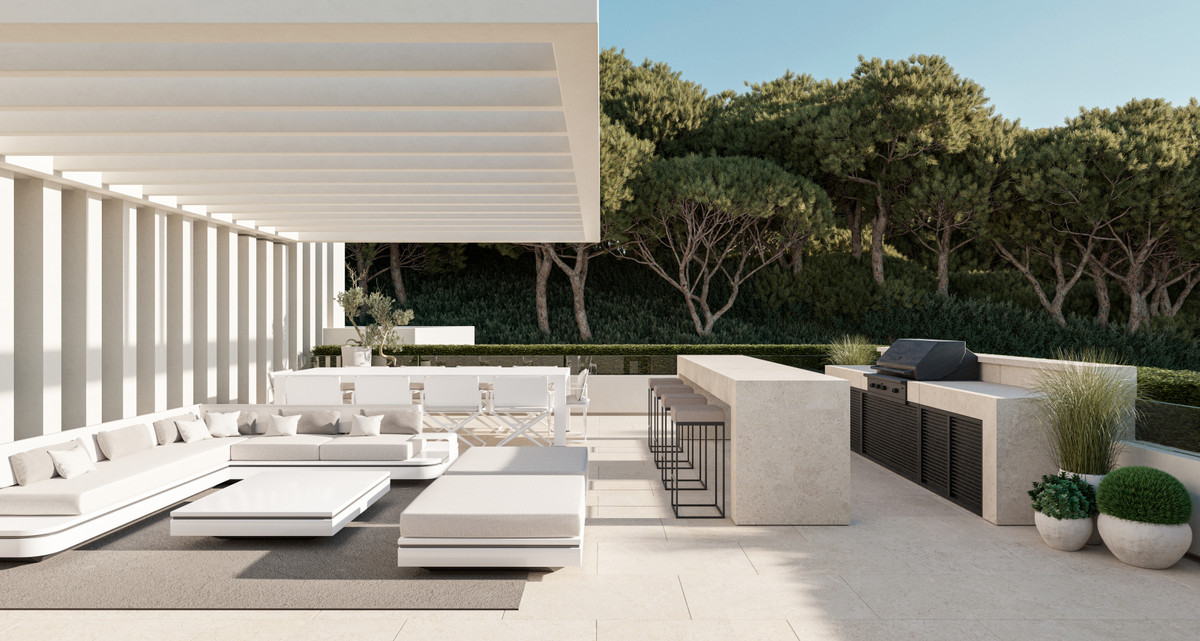 El Bosque II – Villa Forest Bay – Benahavís - luxury outdoor terrace with white modular seating, outdoor kitchen and pergola