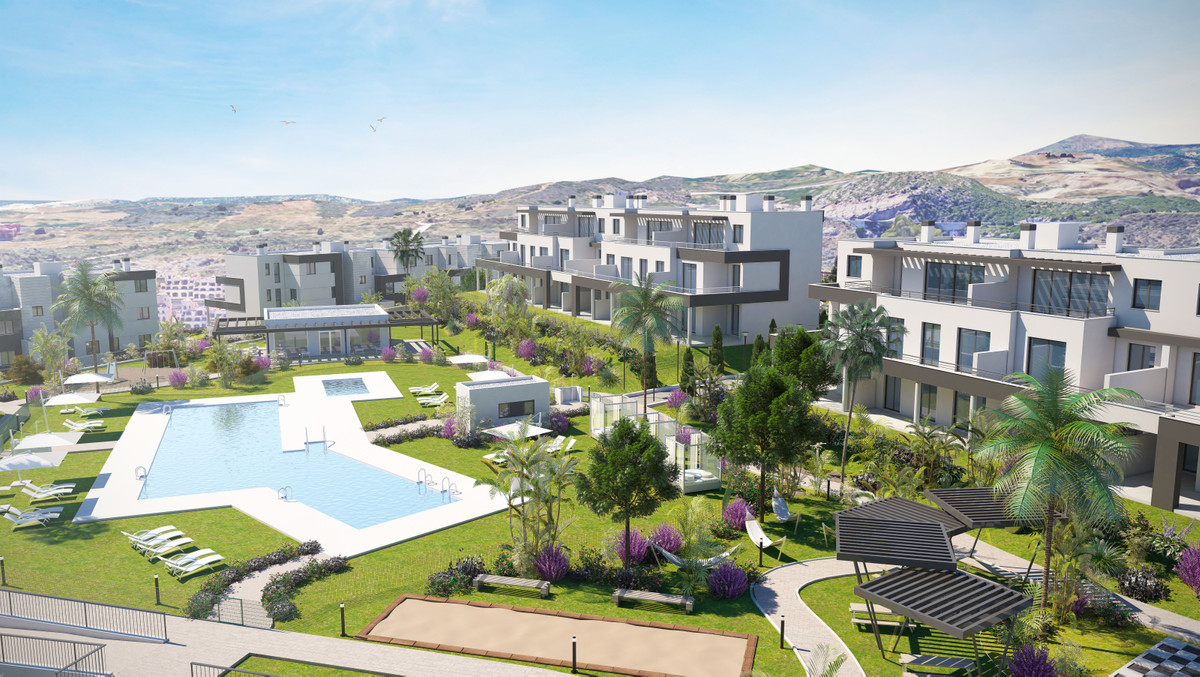 Habitat Valle Romano – Estepona - aerial view of communal pool, landscaped gardens and modern residential buildings with mountain backdrop
