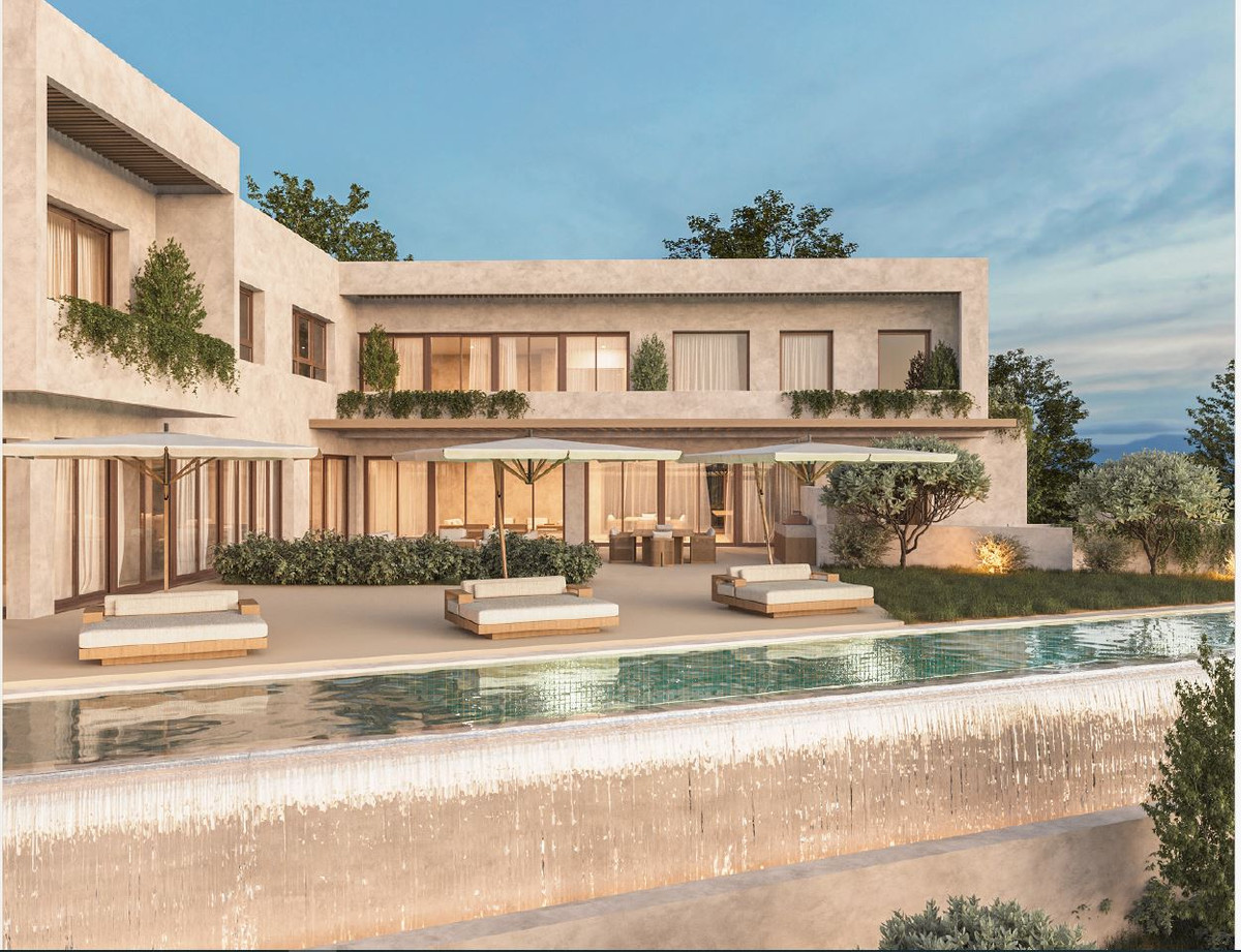 HL SG122 – Alhaurín el Grande - luxury villa exterior with infinity pool, sun loungers and illuminated terrace at dusk