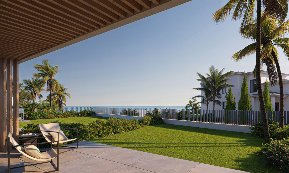 Horizonte Village – The Residences – Mijas - shaded terrace with lounge chairs overlooking landscaped garden and sea views