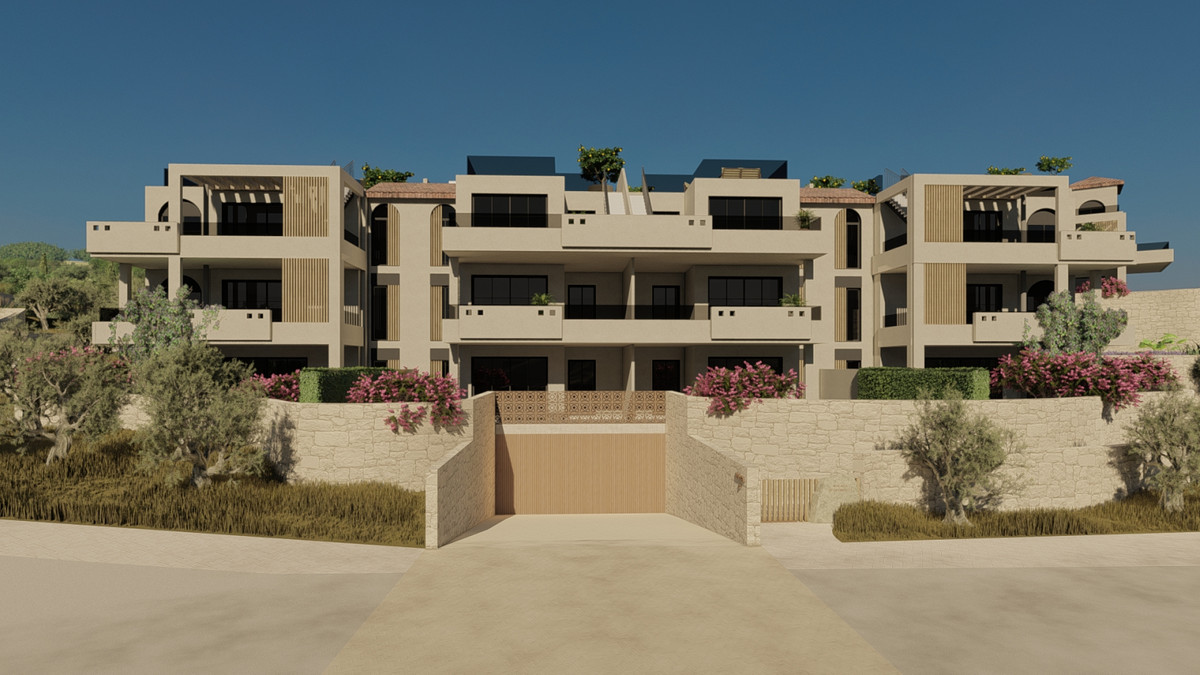 Luna Nova Residences – Apartments – Guaro - exterior facade of beige multi-storey residential complex with rooftop terraces, balconies, and landscaped gardens featuring olive trees and bougainvillea