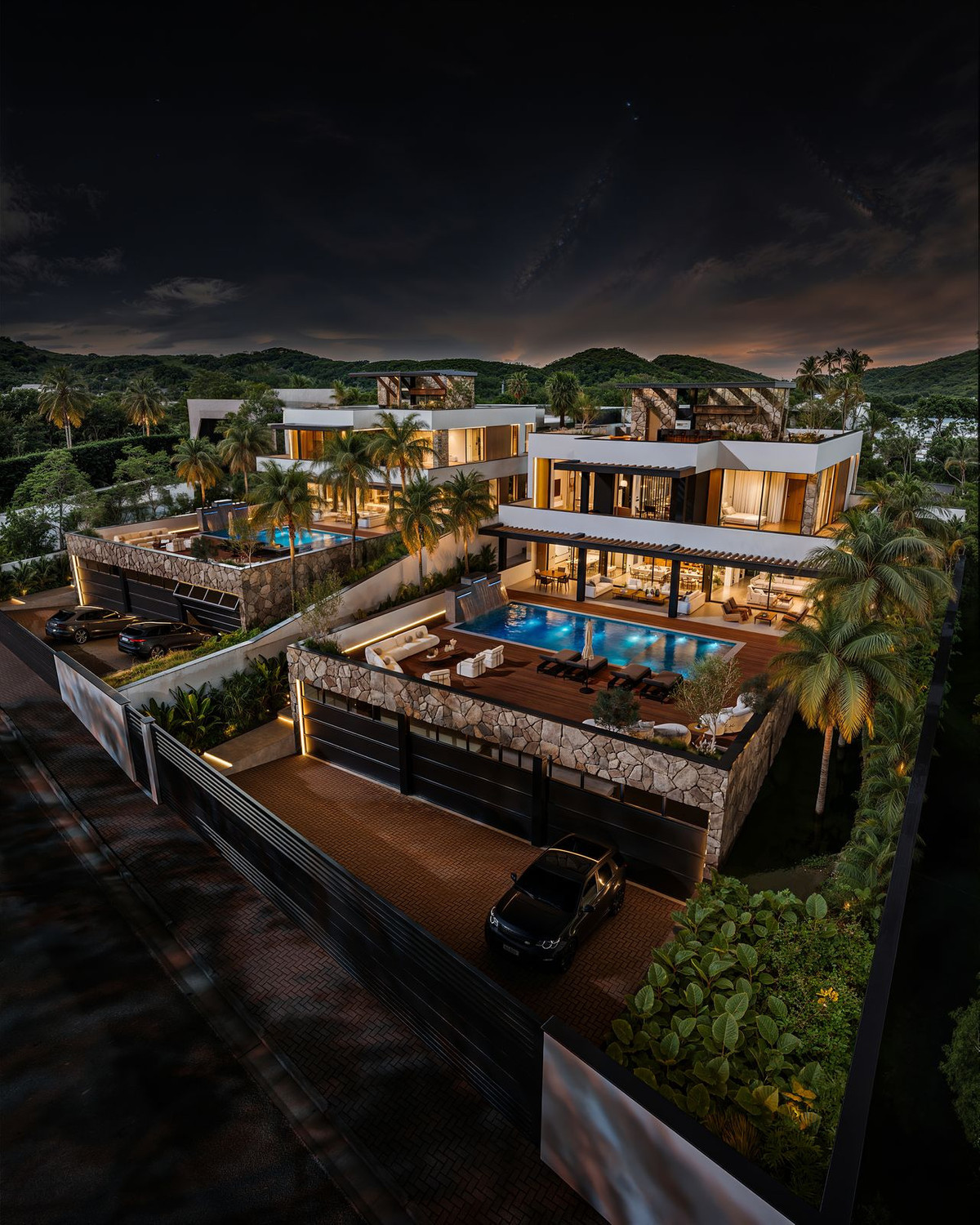 Manzanilla 12 – New Golden Mile - aerial night view of luxury villa with illuminated pool, terraces, and tropical gardens