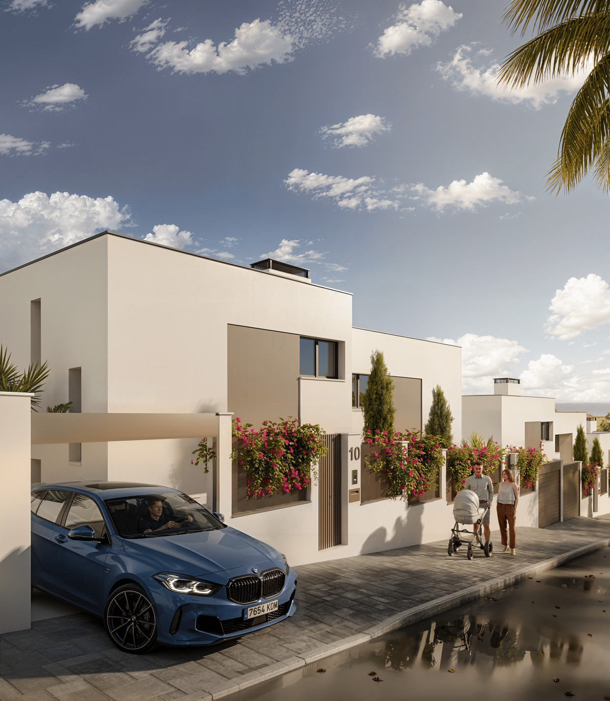 Martagina Hills – Manilva - modern white cubic townhouses exterior with blue BMW, flowering bougainvillea and young family strolling
