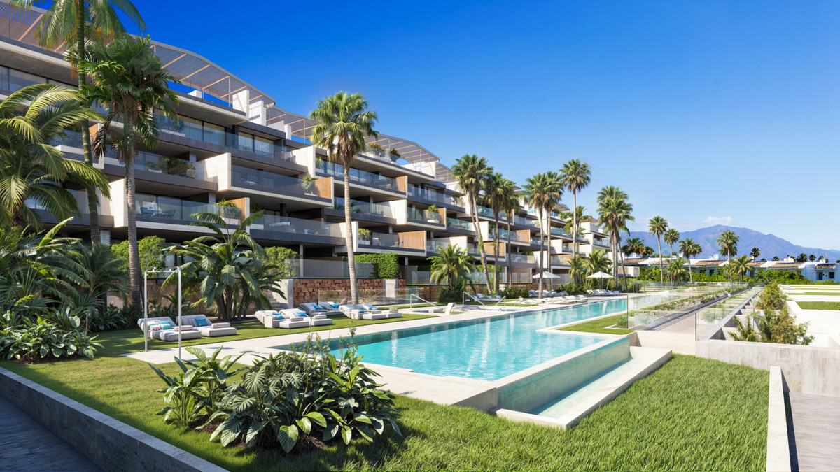 Nubay – Manilva - luxury new-build exterior with infinity pool, palm-lined gardens and tiered balconies on the Costa del Sol
