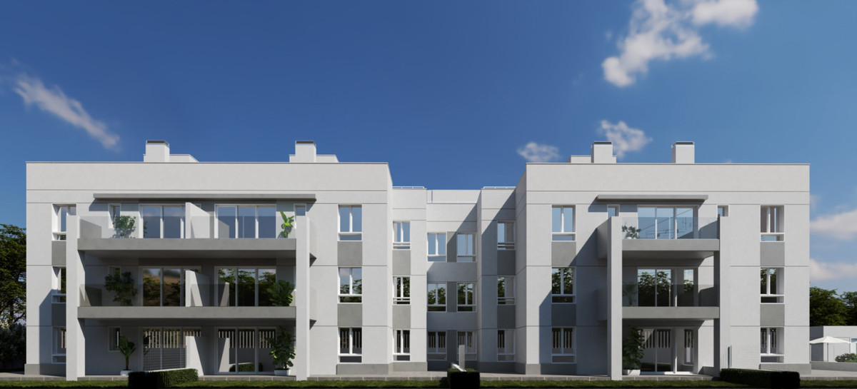 OCEANIC GARDEN – Mijas - modern white three-storey residential facade with large glazed balconies and landscaped frontage