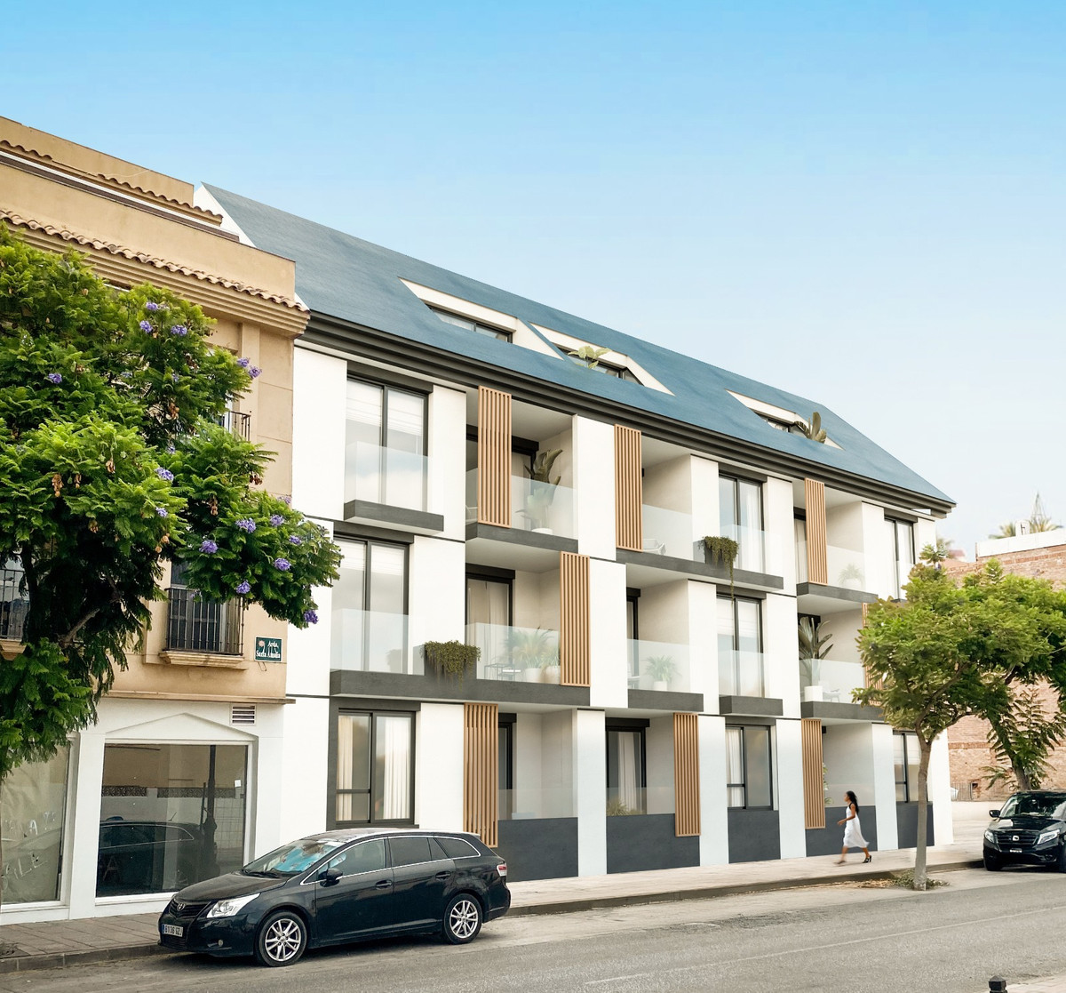 Pelit Maritimo – Fuengirola - modern white new-build apartment facade with balconies and dark slate roof in Fuengirola