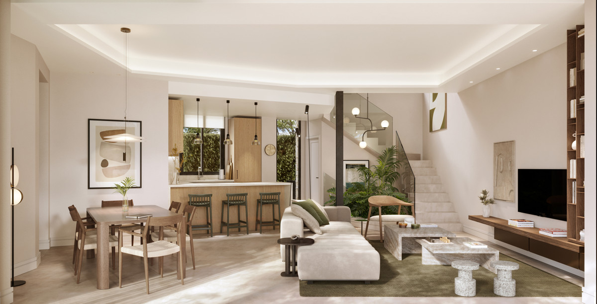 Portugal 2 – Málaga Este - open-plan living, dining and kitchen area with staircase and indoor greenery