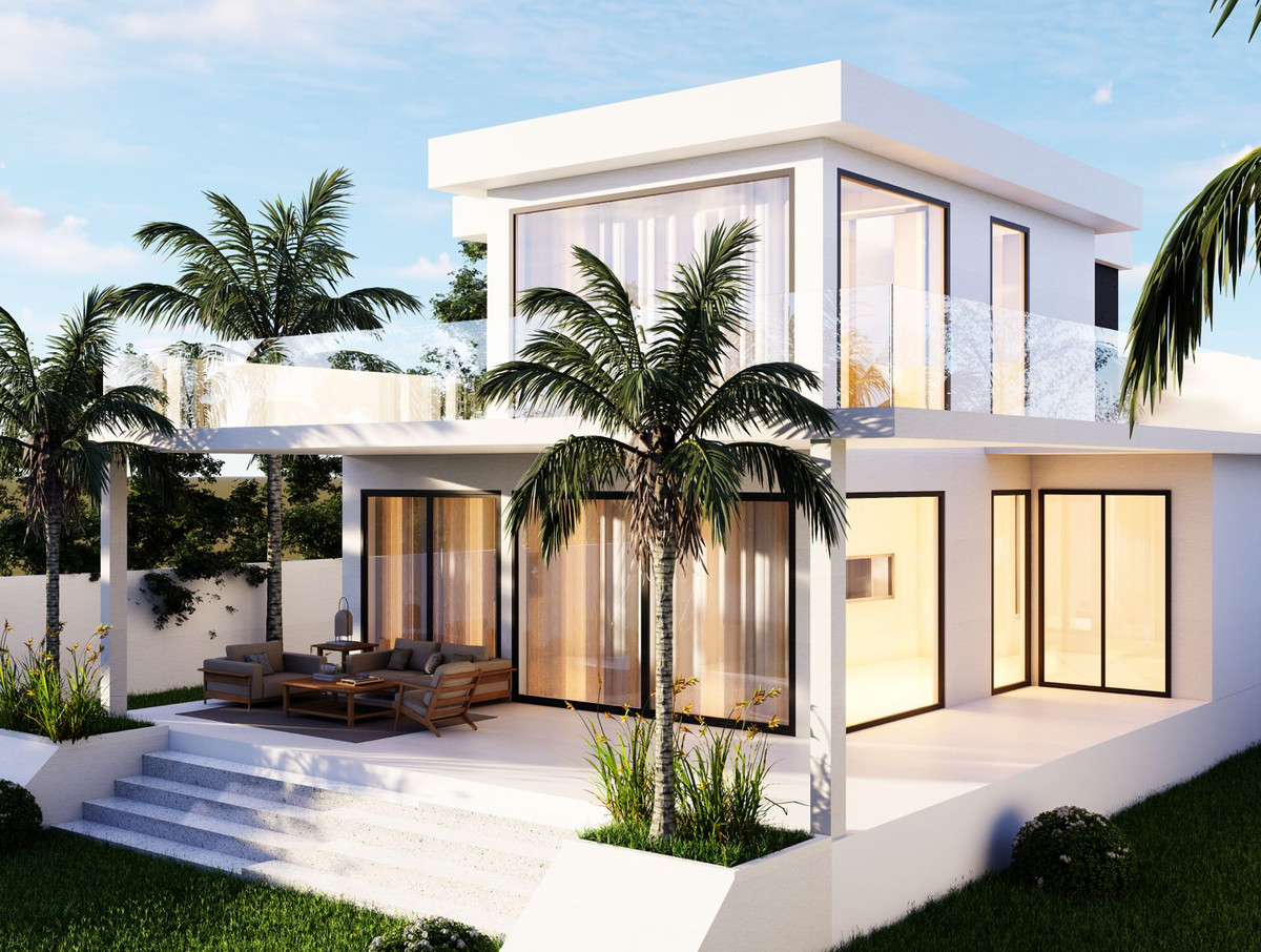 Sakura – Valle Romano - modern two-storey white villa exterior with floor-to-ceiling glazing, covered terrace, and palm-lined garden in Málaga
