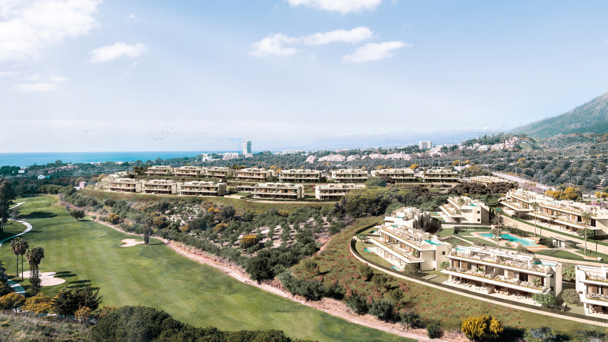 Santa Clara Homes – Marbella - aerial view of luxury residential development beside golf course with Mediterranean Sea backdrop