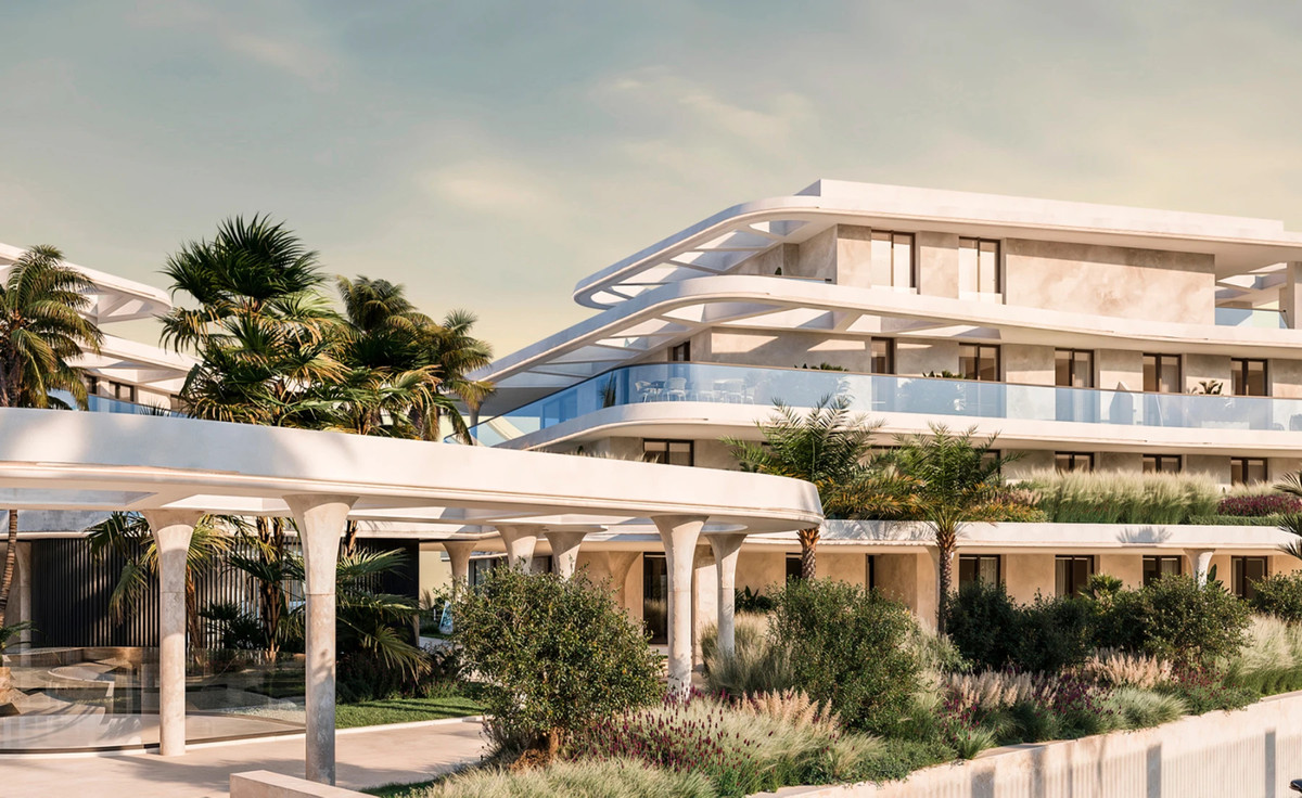 Solaia – Bel Air - luxury new-build exterior with curved white façade, glass balconies, and lush Mediterranean gardens
