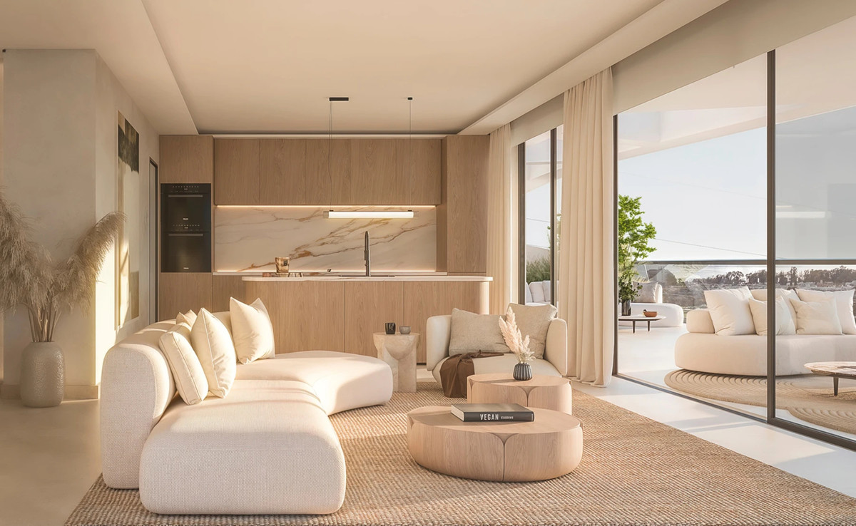 Solaia – Bel Air - open-plan living room and kitchen with cream sofa, wooden coffee tables, and terrace views
