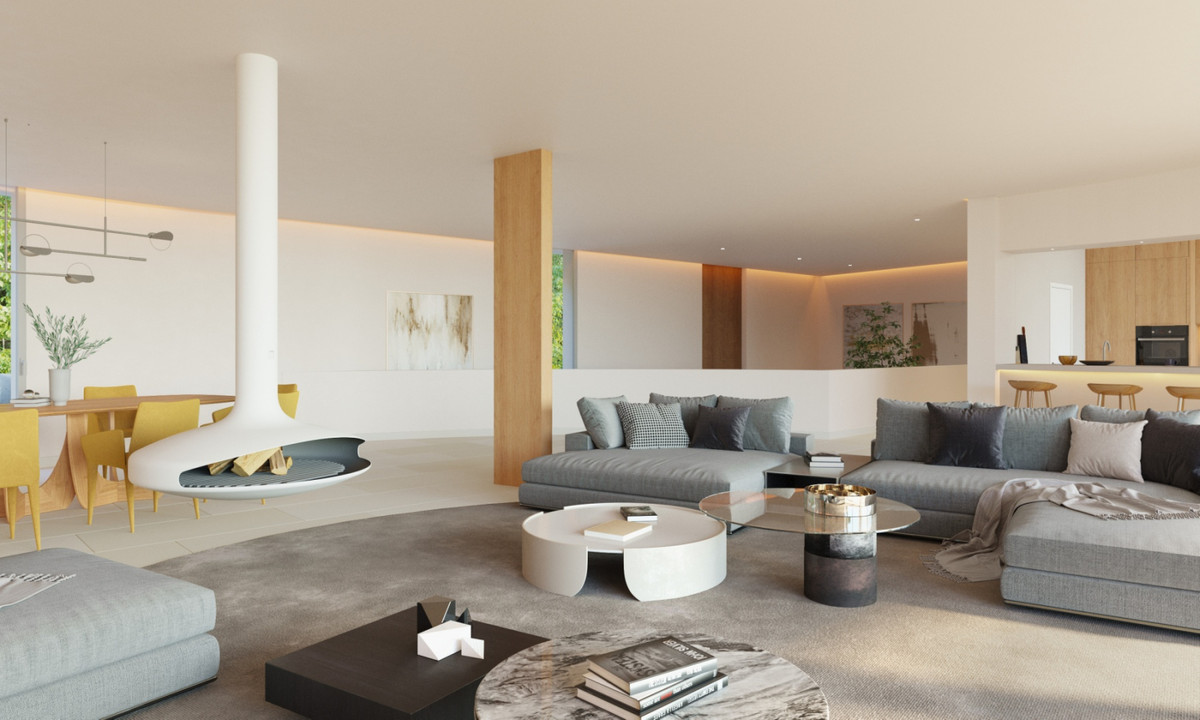 The Bay 7 – Benalmadena - open-plan living room with suspended fireplace, grey sectional sofas and round coffee tables
