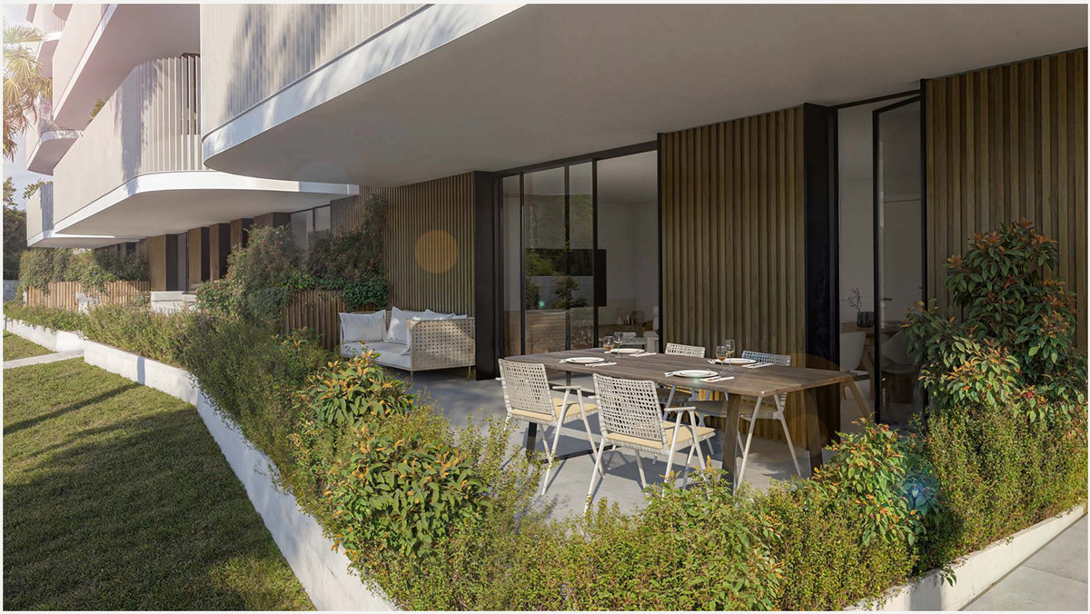 The Oak 48 – Estepona - covered ground-floor terrace with outdoor dining set and landscaped garden
