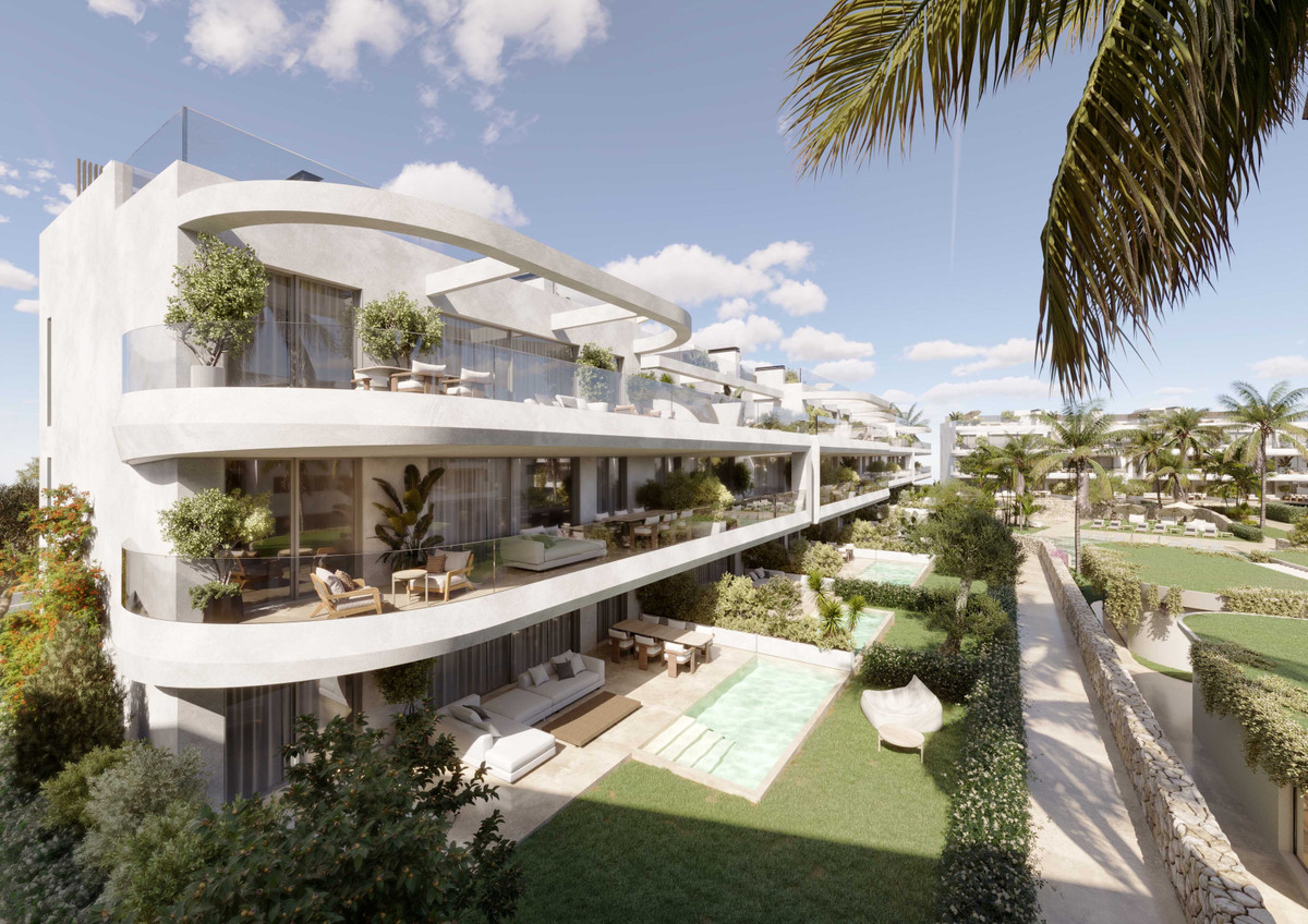 The Palms at Estepona – Estepona - curved white contemporary facade with terraces, lush gardens and private pool