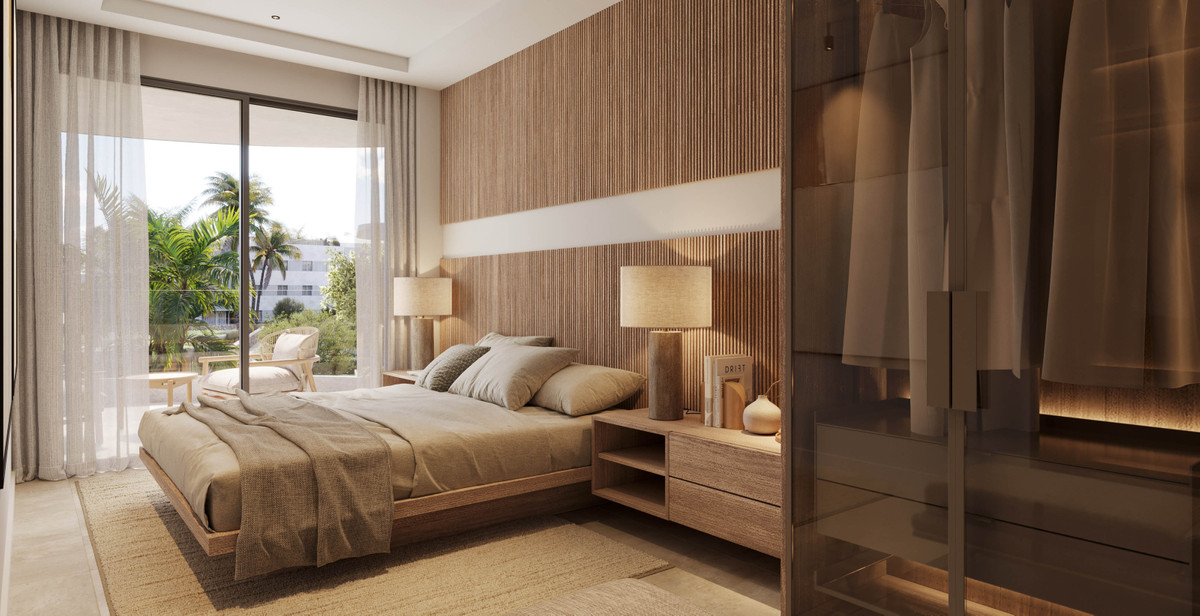 The Palms at Estepona – Estepona - luxury bedroom with slatted wood feature wall, platform bed, and palm-view balcony