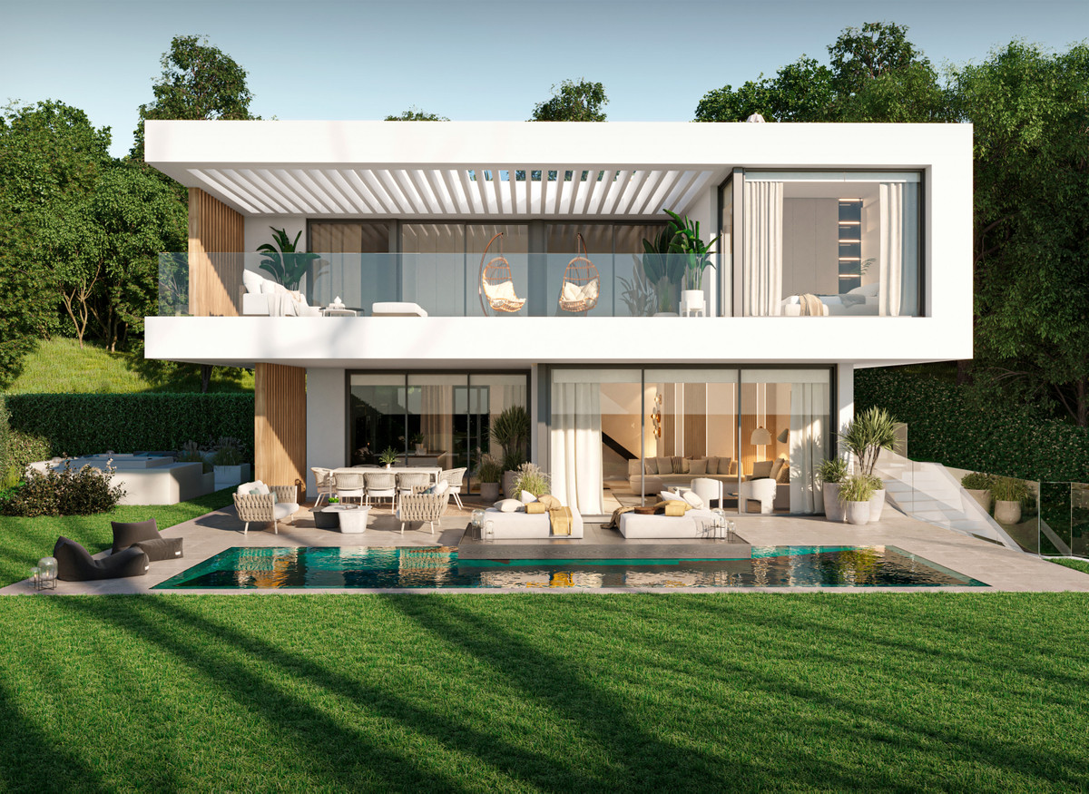 The Seven – New Golden Mile - modern white two-storey villa exterior with pool, terrace, and lush garden