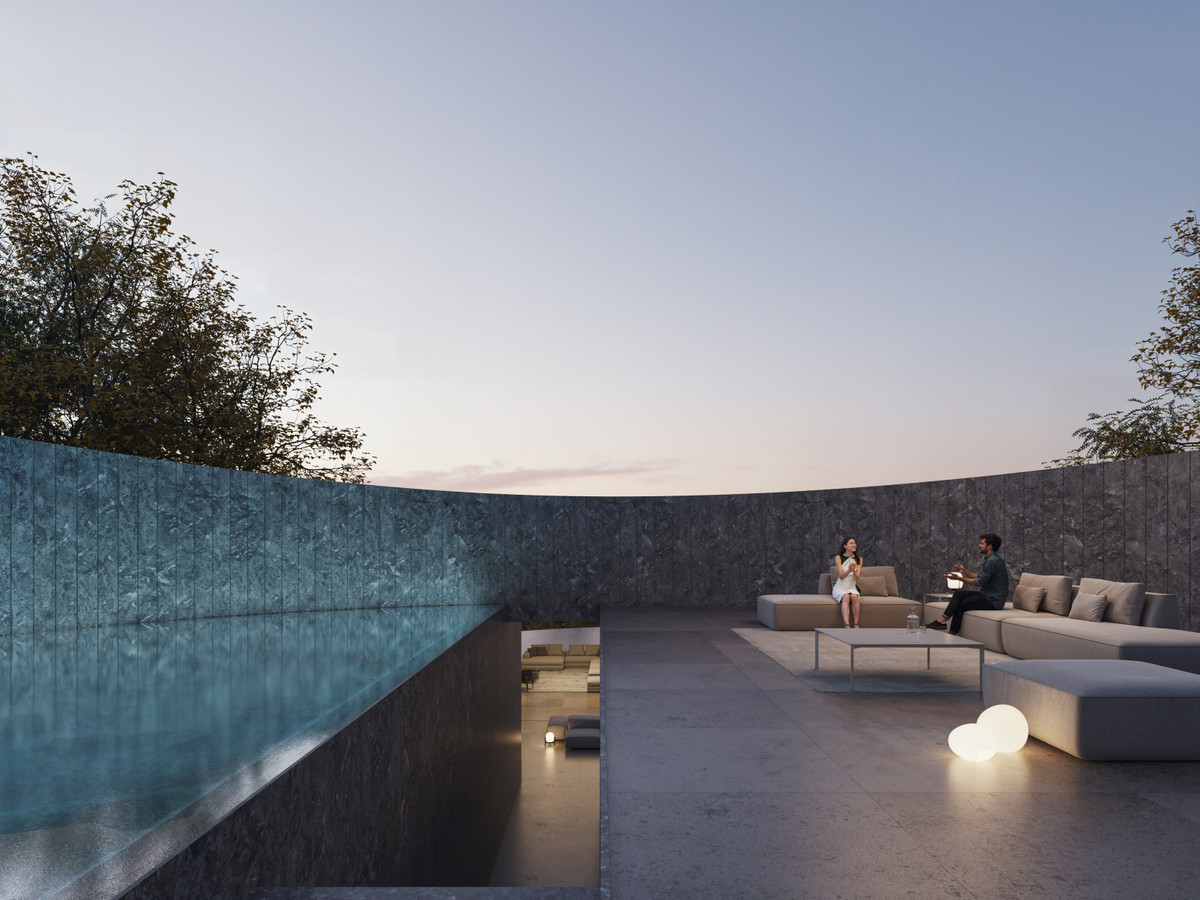 Villa NOON – San Roque - rooftop terrace with infinity pool, outdoor lounge seating and glowing sphere lights at dusk