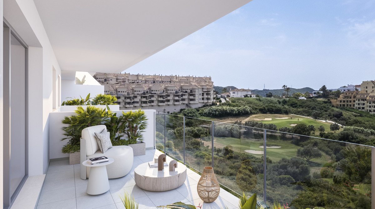 Alonia II – Manilva - furnished terrace with glass balustrade overlooking golf course and residential hillside