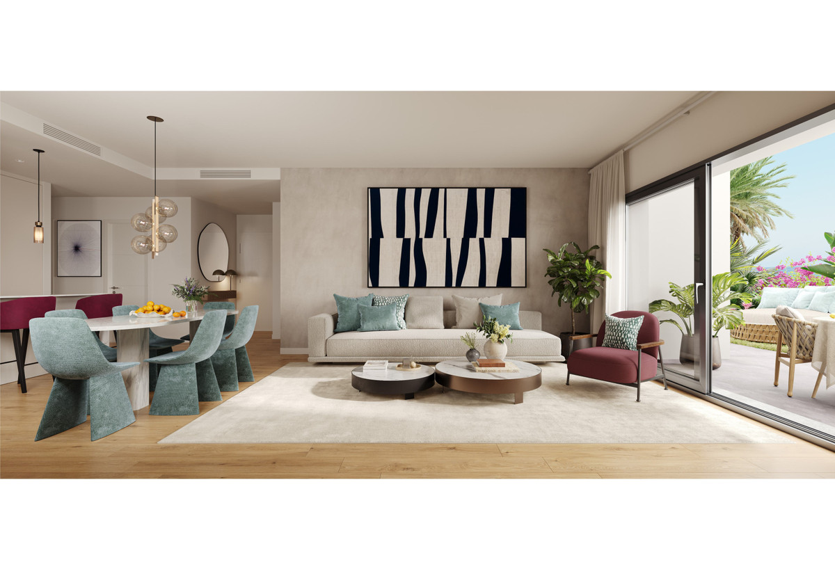 Alura Living – Casares - open-plan living and dining room with teal chairs, cream sofa, and terrace access