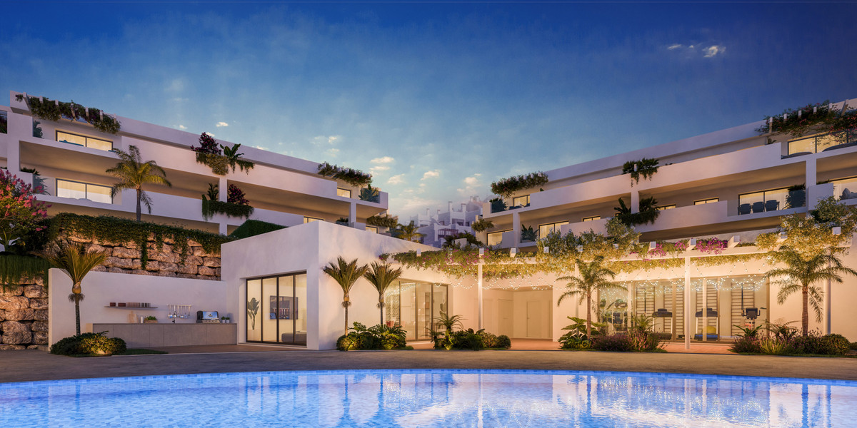 Amaranta Living – Casares - luxury residential complex exterior with pool, terraces and lush greenery at dusk