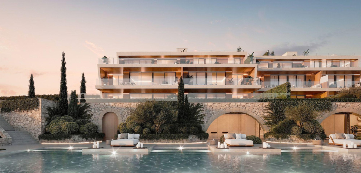Amenábar Cortesín – Casares - luxury exterior facade with infinity pool, stone arches, and terraced apartments at sunset