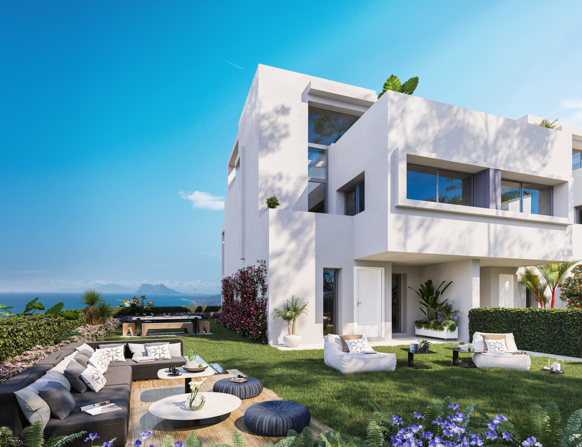 Golden View II – Manilva - modern white exterior with landscaped garden, outdoor lounge seating and panoramic sea views towards Gibraltar