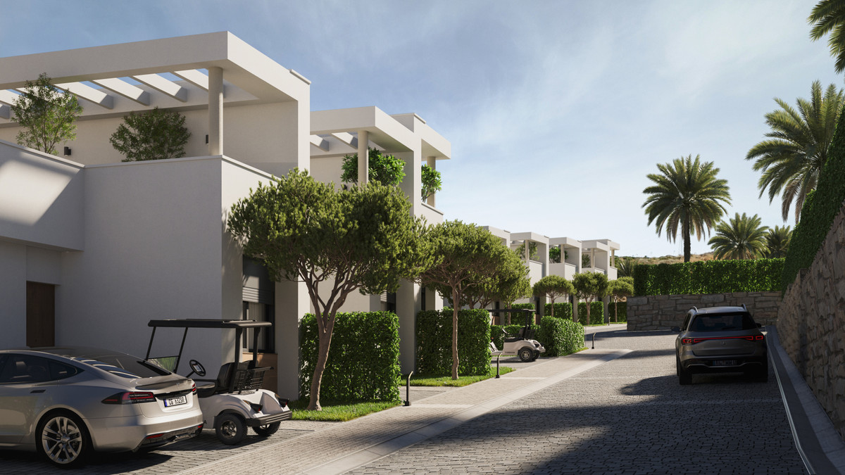 Green Valley – Cerros del Aguila - cobblestone street lined with white contemporary villas, manicured hedges, palm trees and parked golf cart