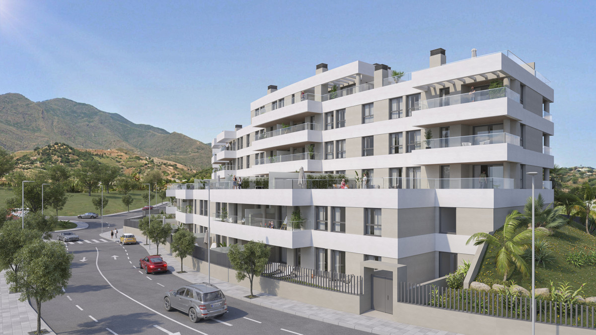 Insur Scala – Estepona - modern multi-storey residential facade with balconies, mountain backdrop and palm-lined street