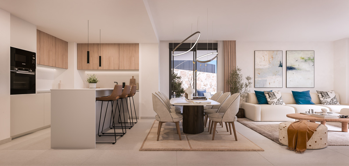 Medblue IV – Altos de los Monteros - open-plan kitchen, dining and living area with warm neutral tones and modern pendant lighting