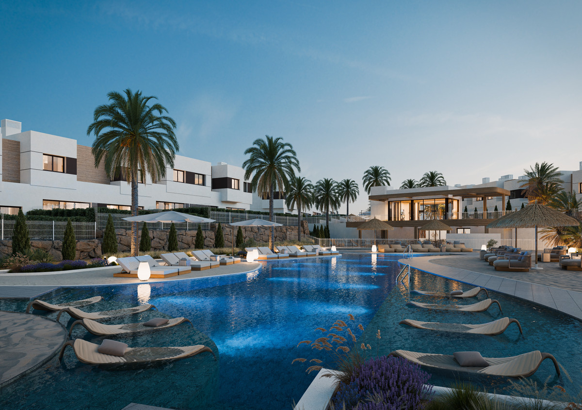 Savia – Fase 1 – Mijas - luxury outdoor pool with sun loungers, palm trees and modern white residential buildings at dusk