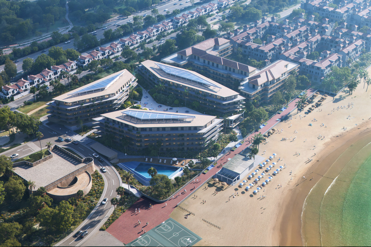 Vesta Mare – La Duquesa - aerial view of beachfront luxury development with rooftop solar panels, pool, and sandy beach