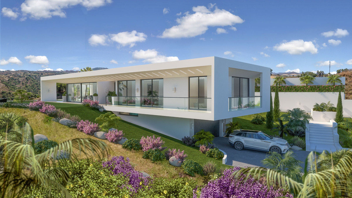 Villa Celestia – La Cala Golf - modern white luxury villa exterior with landscaped gardens, glass balustrades and mountain backdrop