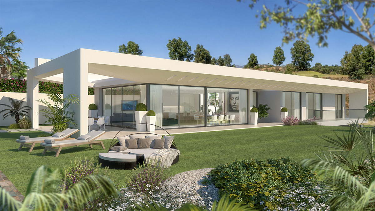 Villa Celestia – La Cala Golf - modern white single-storey villa exterior with floor-to-ceiling glass doors and landscaped garden