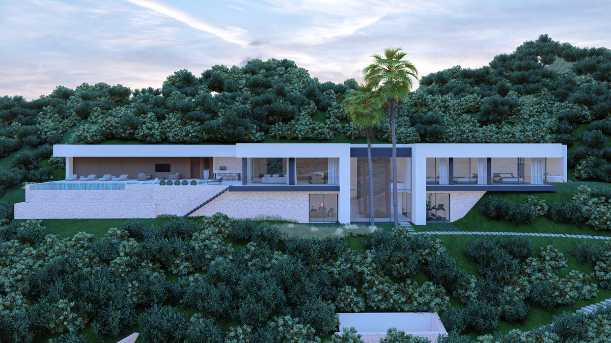 Villa E20 – Benahavís - modern luxury villa exterior with infinity pool, terraces and lush hillside landscaping at dusk