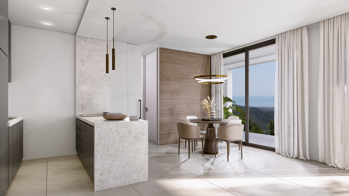 Villa Evania – Benahavís - open-plan kitchen and dining area with marble island, pendant lights, and panoramic sea views