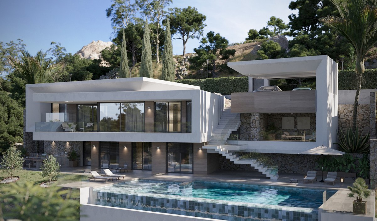 Villa Evania – Benahavís - modern white exterior with infinity pool, terraces, stone accents and hillside backdrop