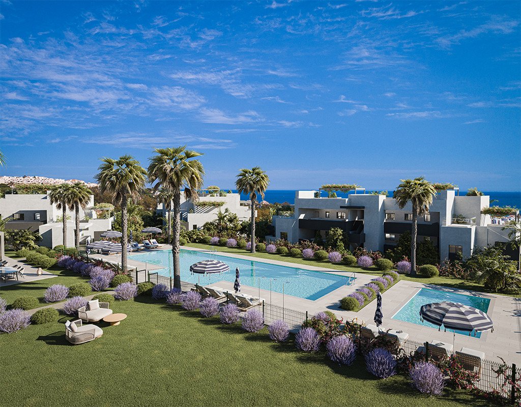 Alura Living FASE I – Casares - luxury communal pool and landscaped gardens with palm trees and sea views