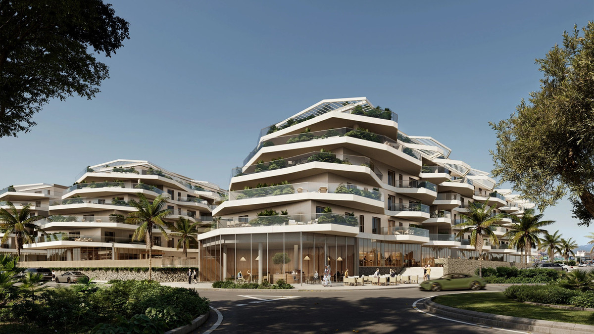 Lakün FASE II – Las Lagunas - luxury terraced residential complex with lush green balconies and glass-fronted ground-floor commercial space in Málaga