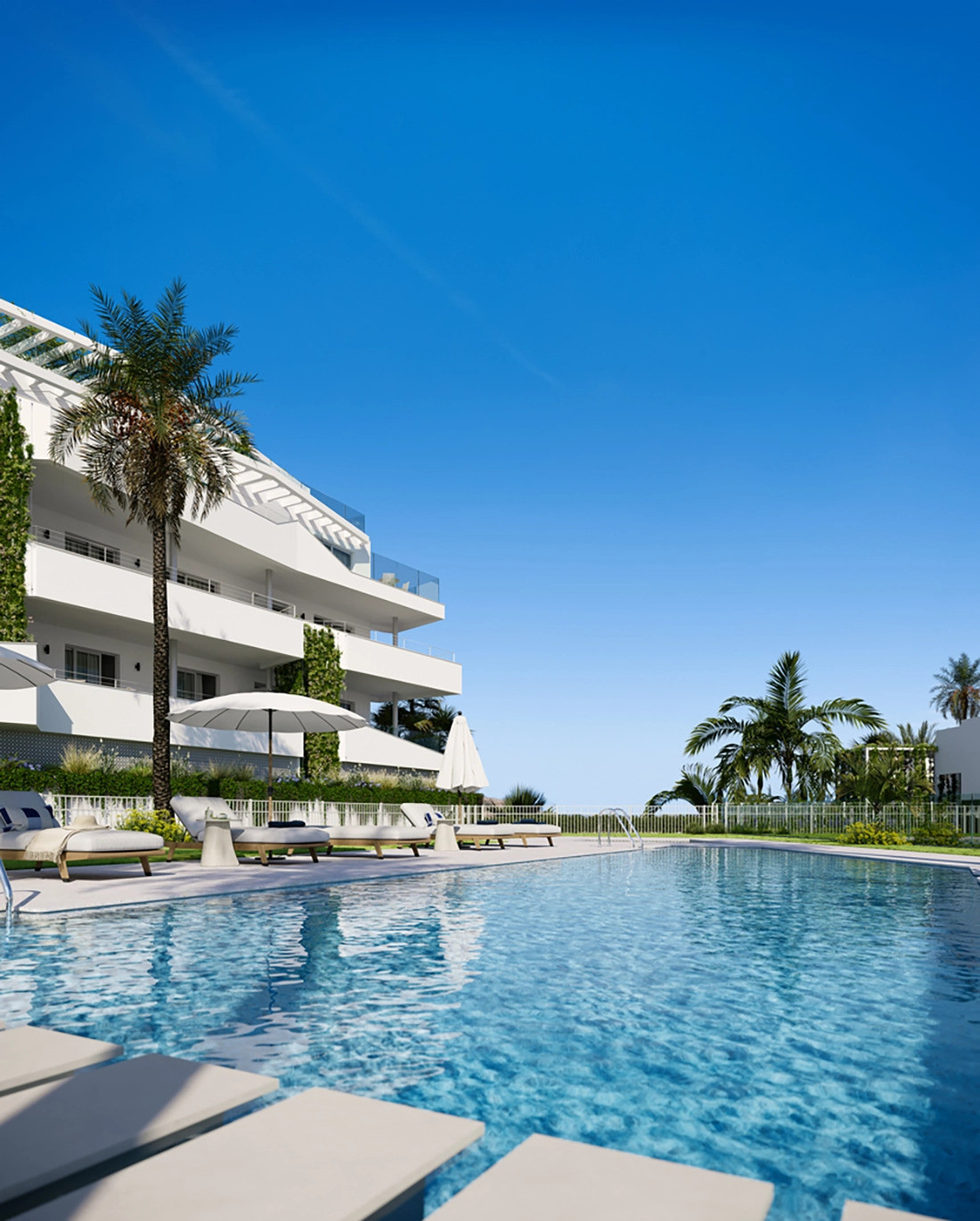 Mijas Seaviews FASE III – Mijas - outdoor swimming pool with sun loungers and white modern facade surrounded by palm trees