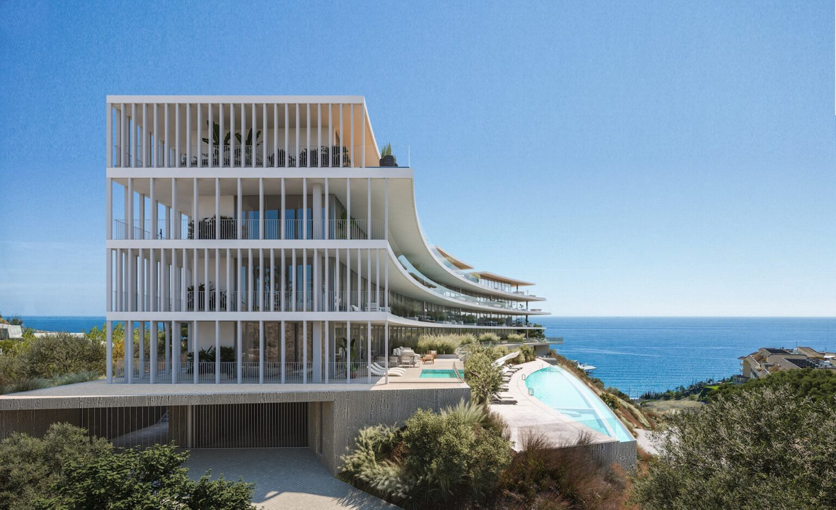 Lighthouse Higuerón Residences – Fuengirola - modern white exterior facade with tiered balconies, infinity pools and sea views