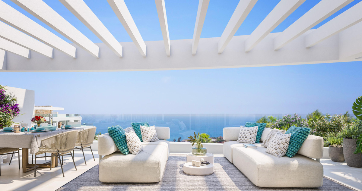 Royal Palms Mijas – FASE IV-2 – La Cala de Mijas - luxury terrace with white pergola, outdoor lounge seating, dining area and panoramic sea views